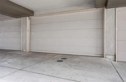 a view of roof deck with table and chairs