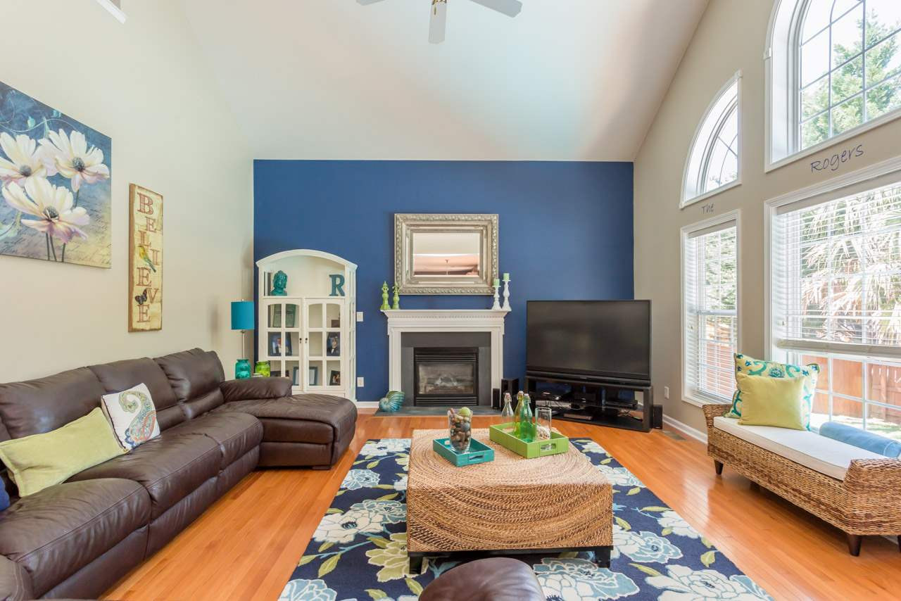 1909 Wescott Drive Raleigh, NC 27614 - Photo 9 of 25 Soaring 2 Story Family Room Features Wall of Windows Overlooking the Serene Back Yard Oasis