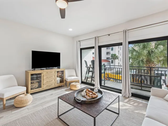 a large white kitchen with cabinets