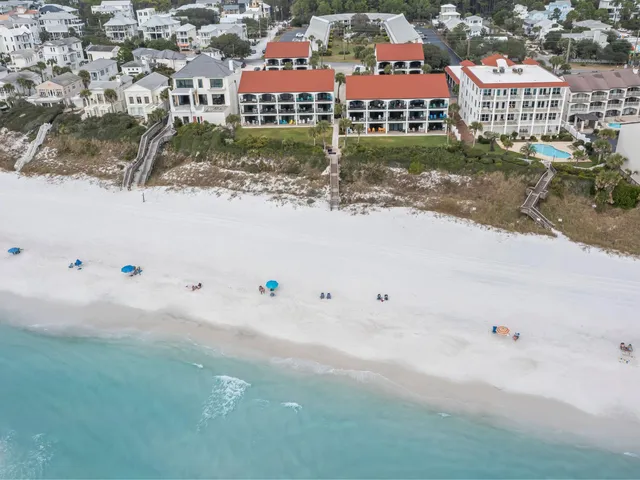 a view of swimming pool with a yard and plants