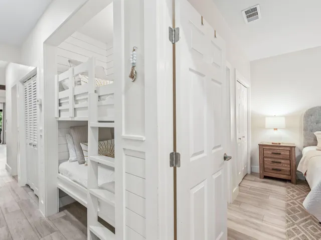 a view of bedroom with wooden floor