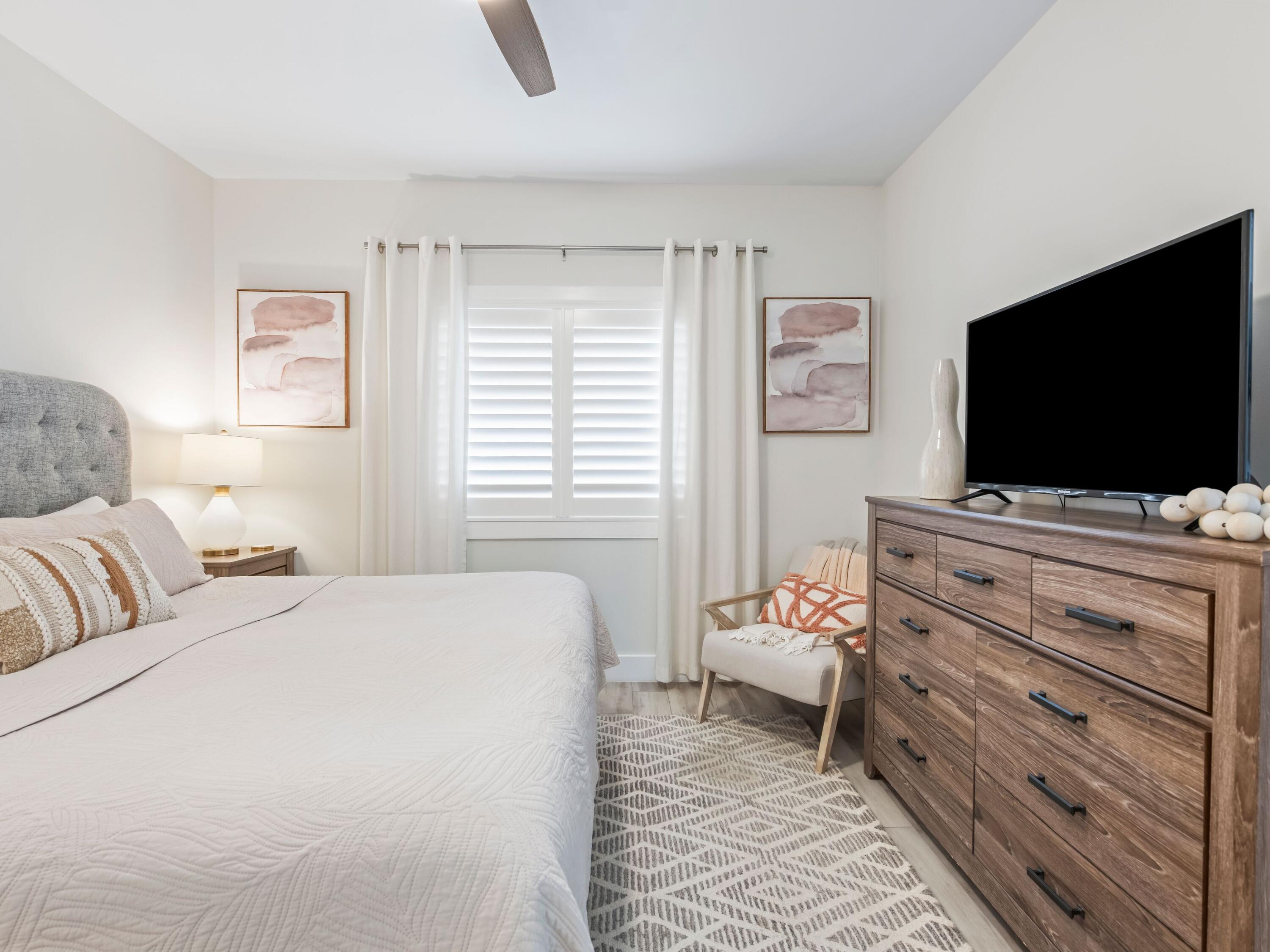 3604 East County Highway 30A, Unit D5 Santa Rosa Beach, FL 32459 - Photo 27 of 45 a bedroom with a bed and a flat screen tv