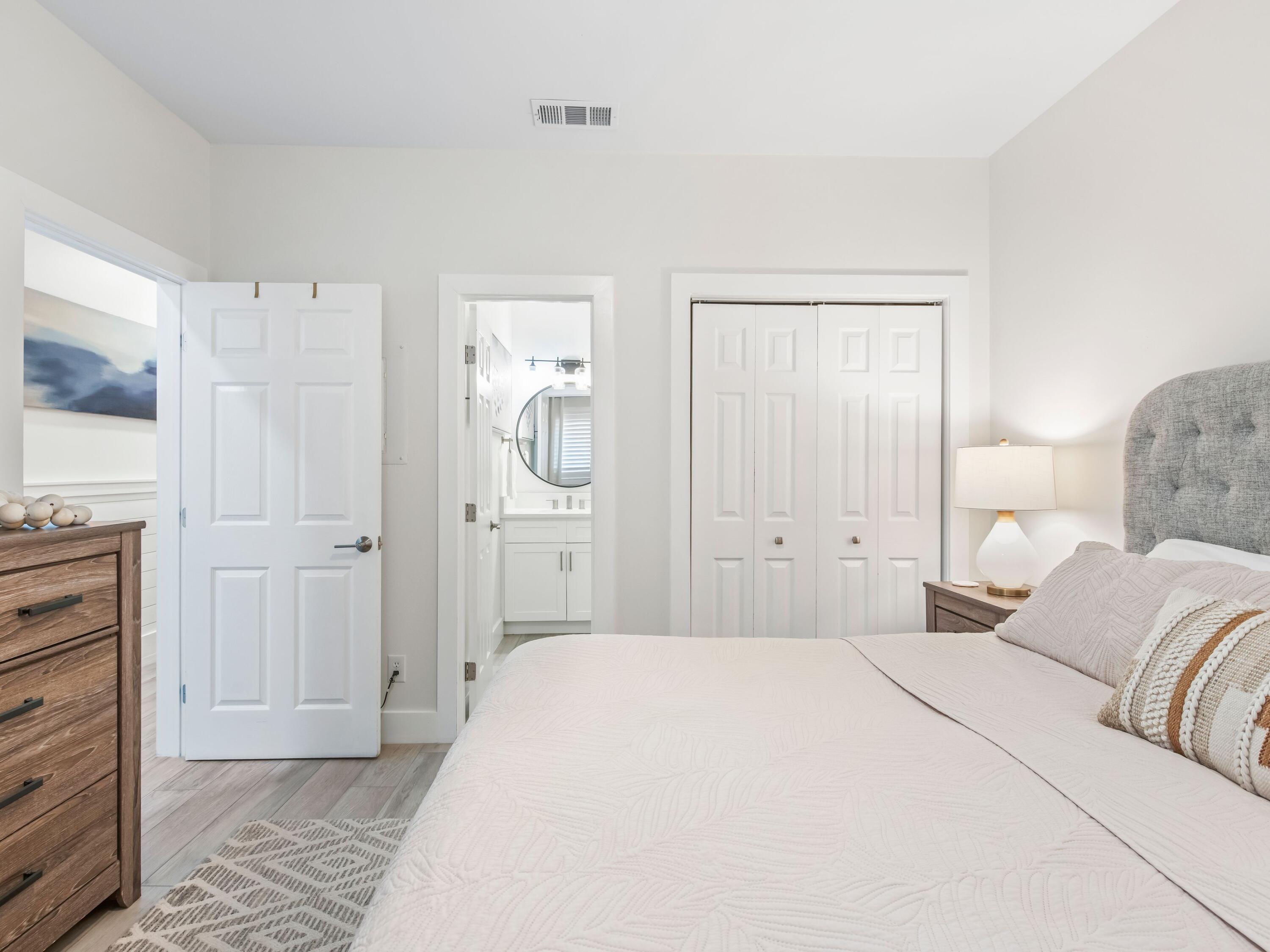 3604 East County Highway 30A, Unit D5 Santa Rosa Beach, FL 32459 - Photo 29 of 45 a bedroom with a bed and cabinets
