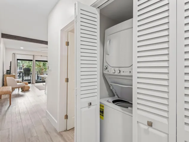 a view of a balcony with chairs and table