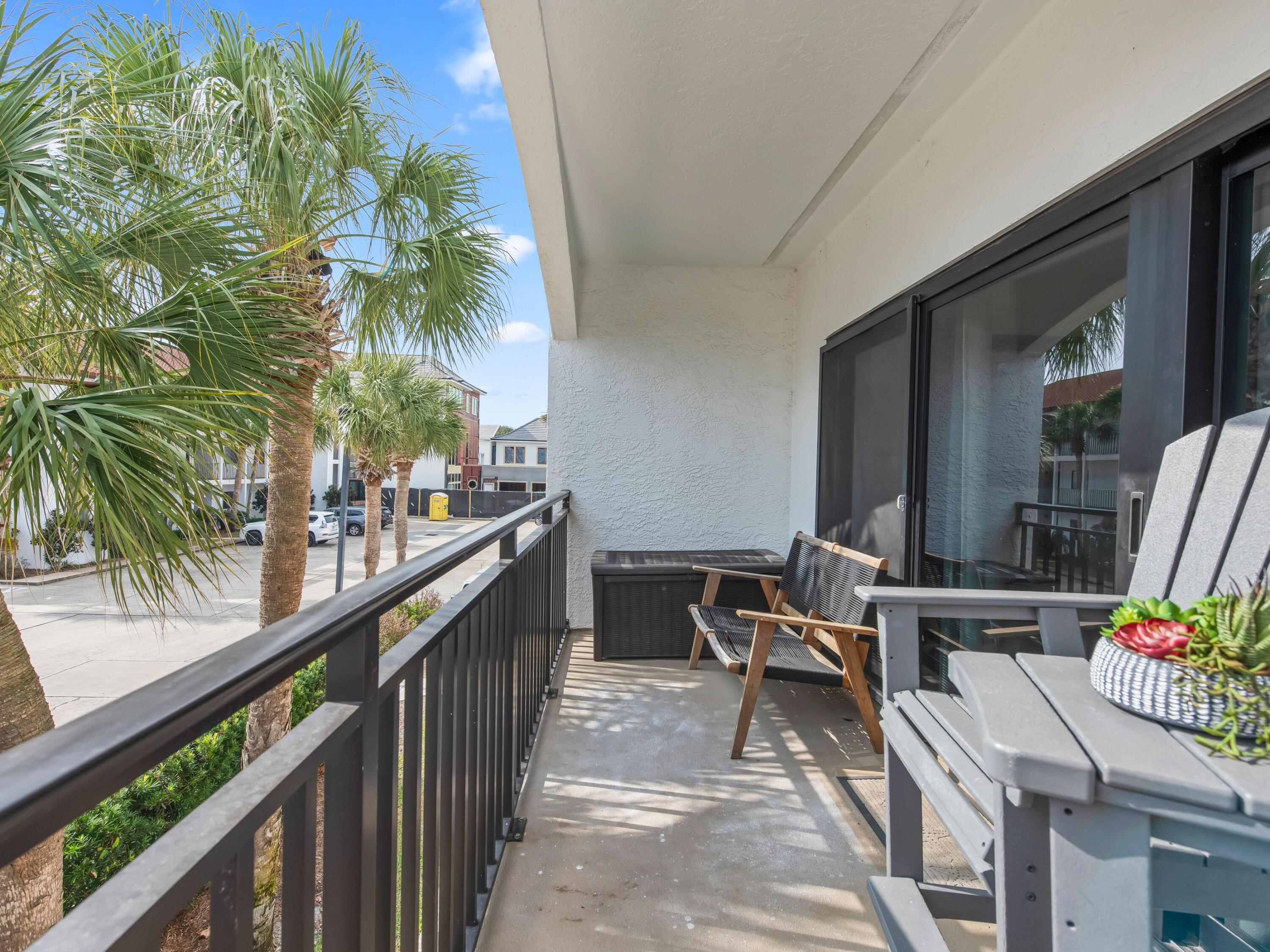 3604 East County Highway 30A, Unit D5 Santa Rosa Beach, FL 32459 - Photo 35 of 45 a view of a balcony with chairs and table