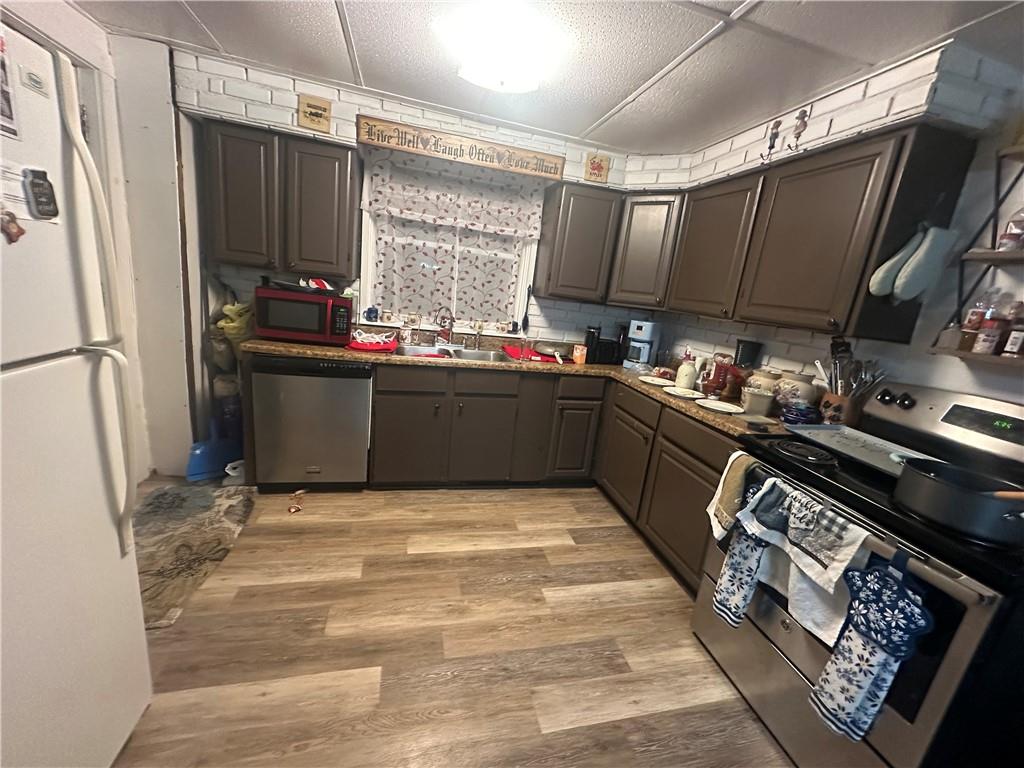 311 South Fourth Street Apollo, PA 15613 - Photo 10 of 27 a kitchen with stainless steel appliances granite countertop a refrigerator stove and sink