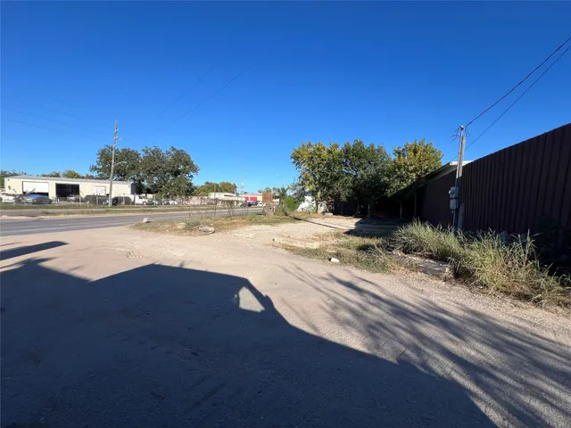 a view of a yard with a table and a chair