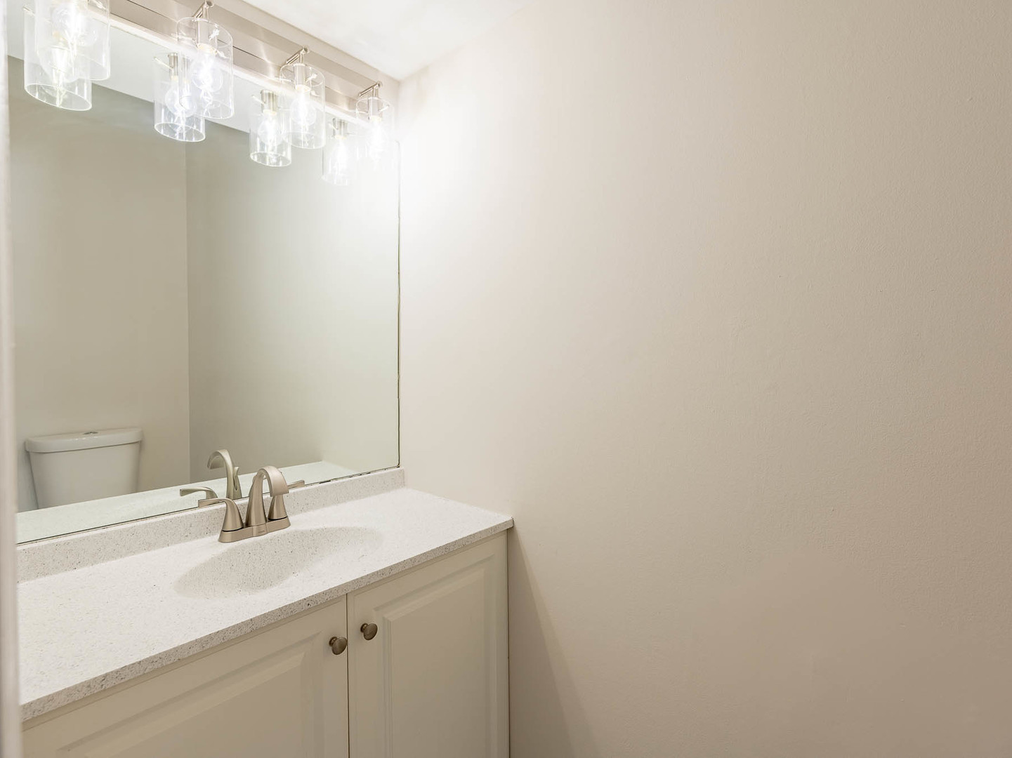 429 6th Street Wheeling, IL 60090 - Photo 11 of 17 a bathroom with a sink and a mirror