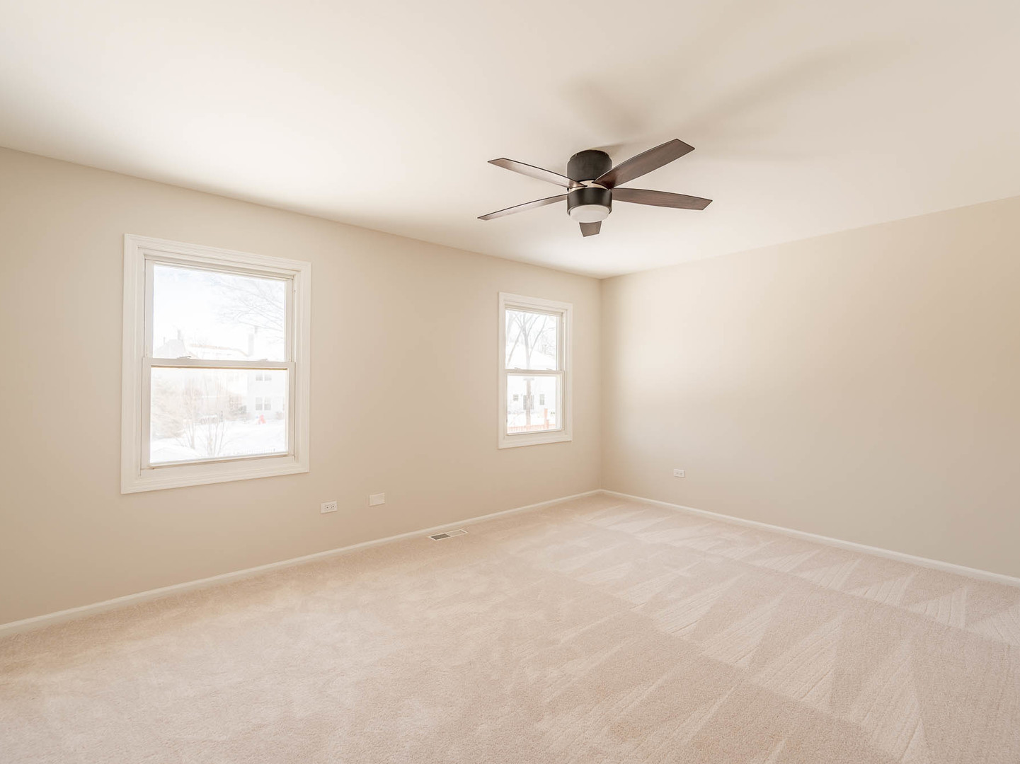 429 6th Street Wheeling, IL 60090 - Photo 14 of 17 an empty room with a window and a fan
