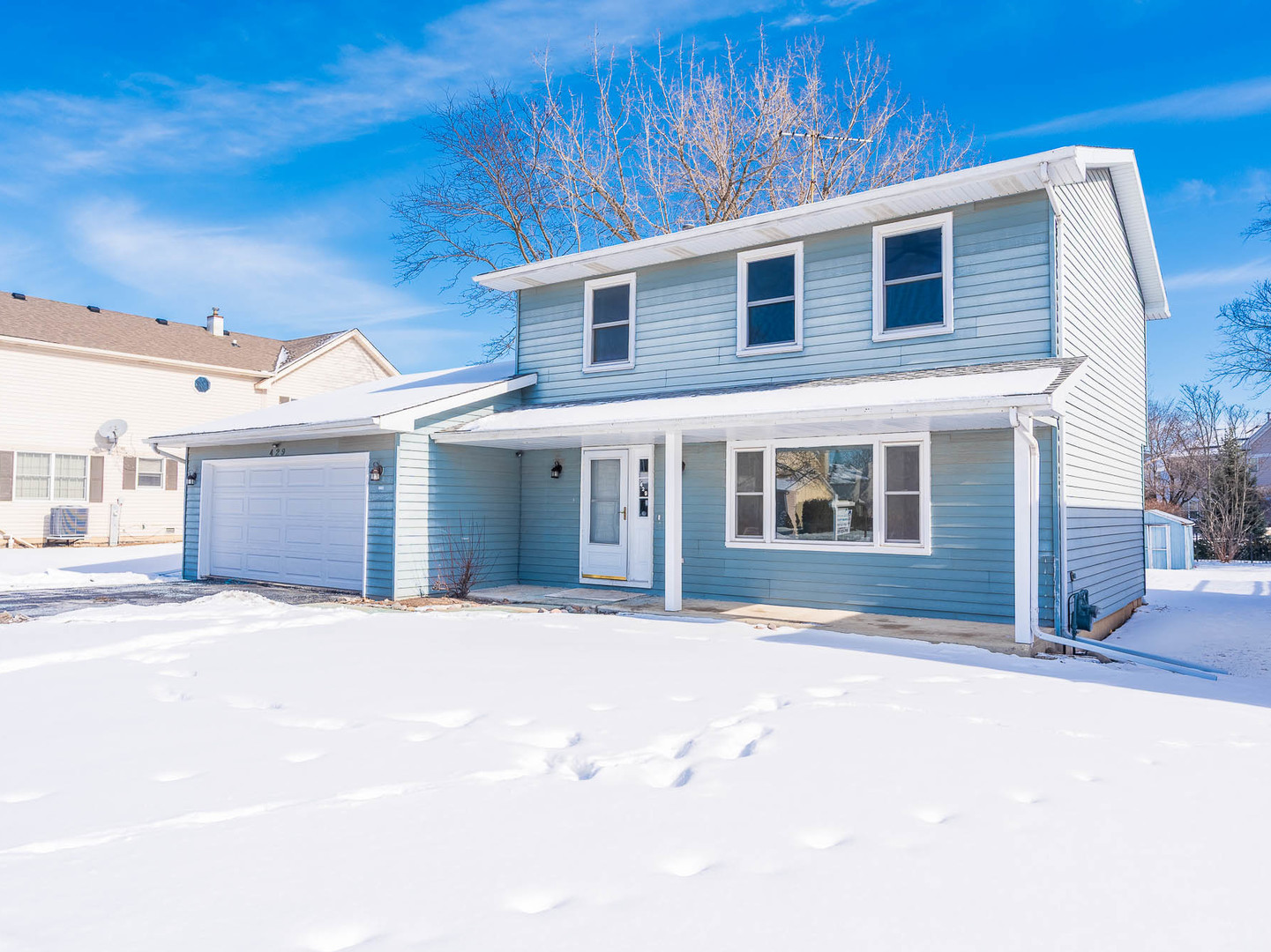 429 6th Street Wheeling, IL 60090 - Photo 2 of 17 a front view of a house with a yard