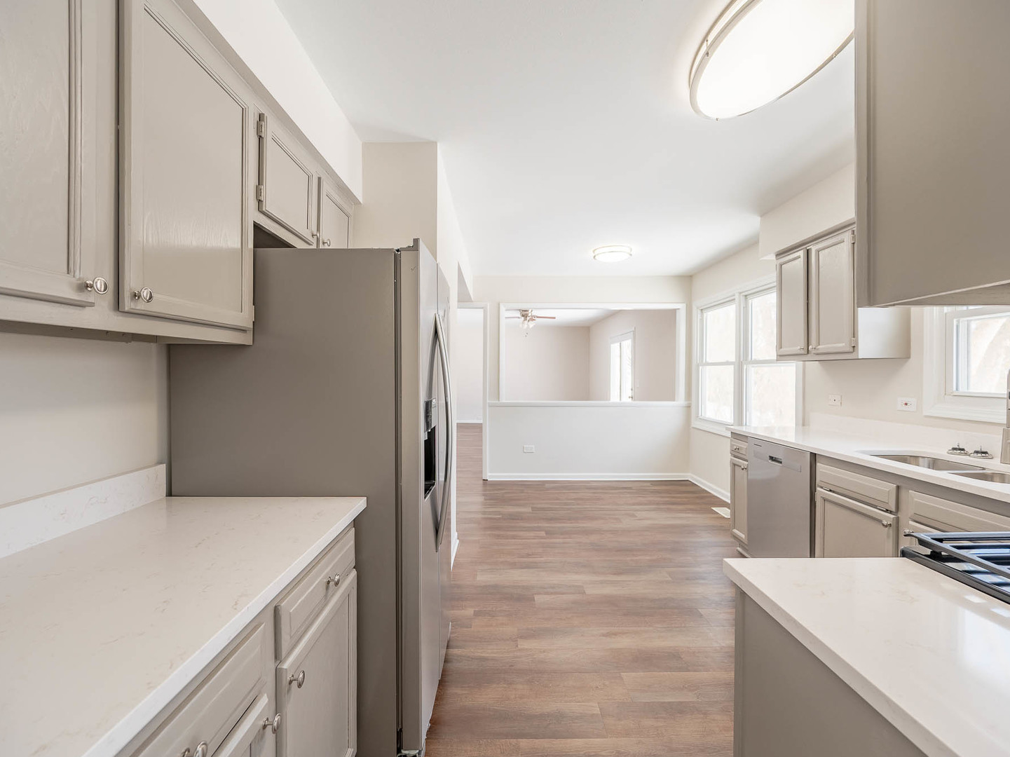 429 6th Street Wheeling, IL 60090 - Photo 8 of 17 a kitchen with a refrigerator sink and cabinets