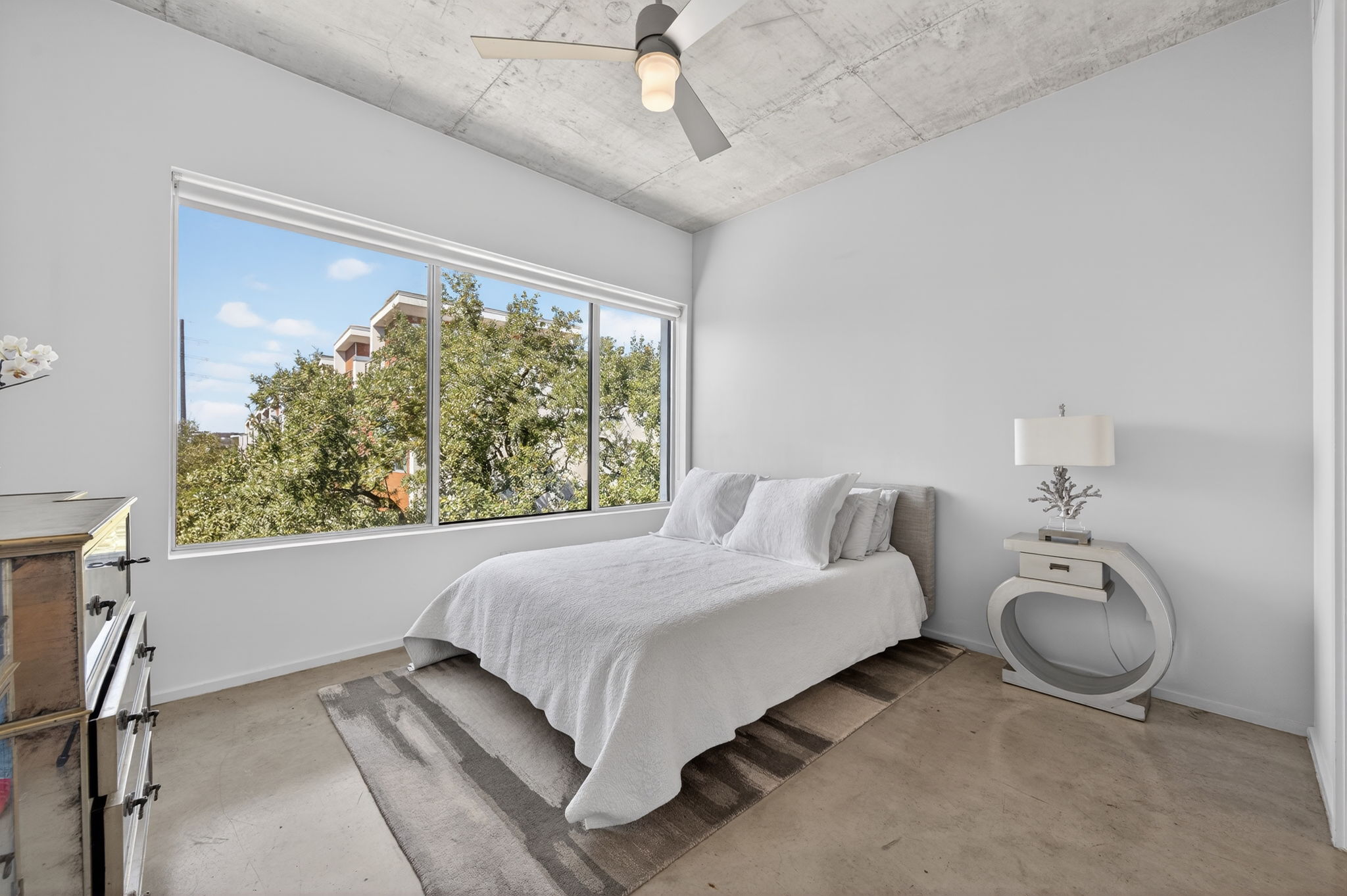 2301 South 5th Street, Unit 25 Austin, TX 78704 - Photo 16 of 35 Bedroom featuring ceiling fan and baseboards
