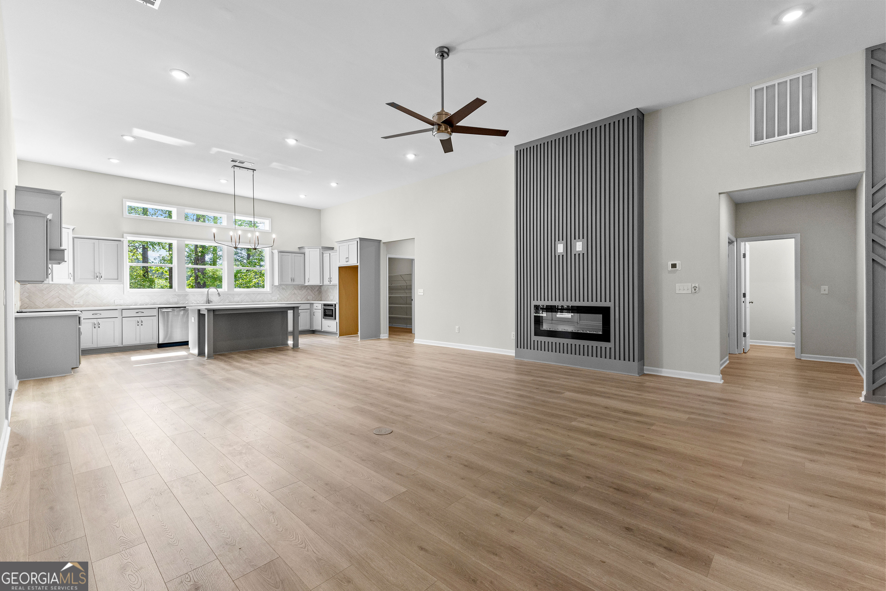 1242 Waymanville Road Thomaston, GA 30286 - Photo 13 of 52 a view of livingroom with hardwood floor and a ceiling fan