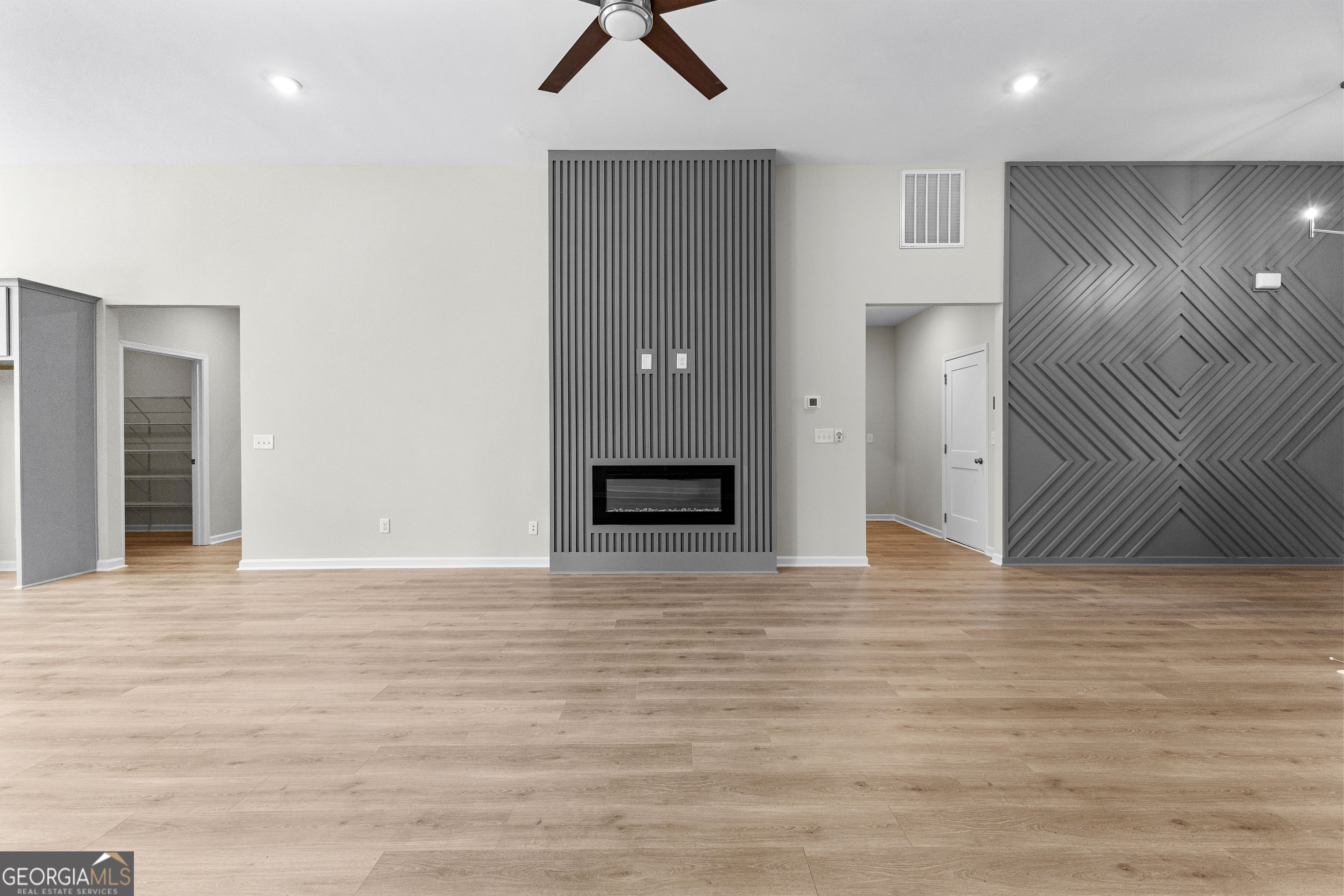 1242 Waymanville Road Thomaston, GA 30286 - Photo 14 of 52 a view of an empty room with wooden floor and cabinet