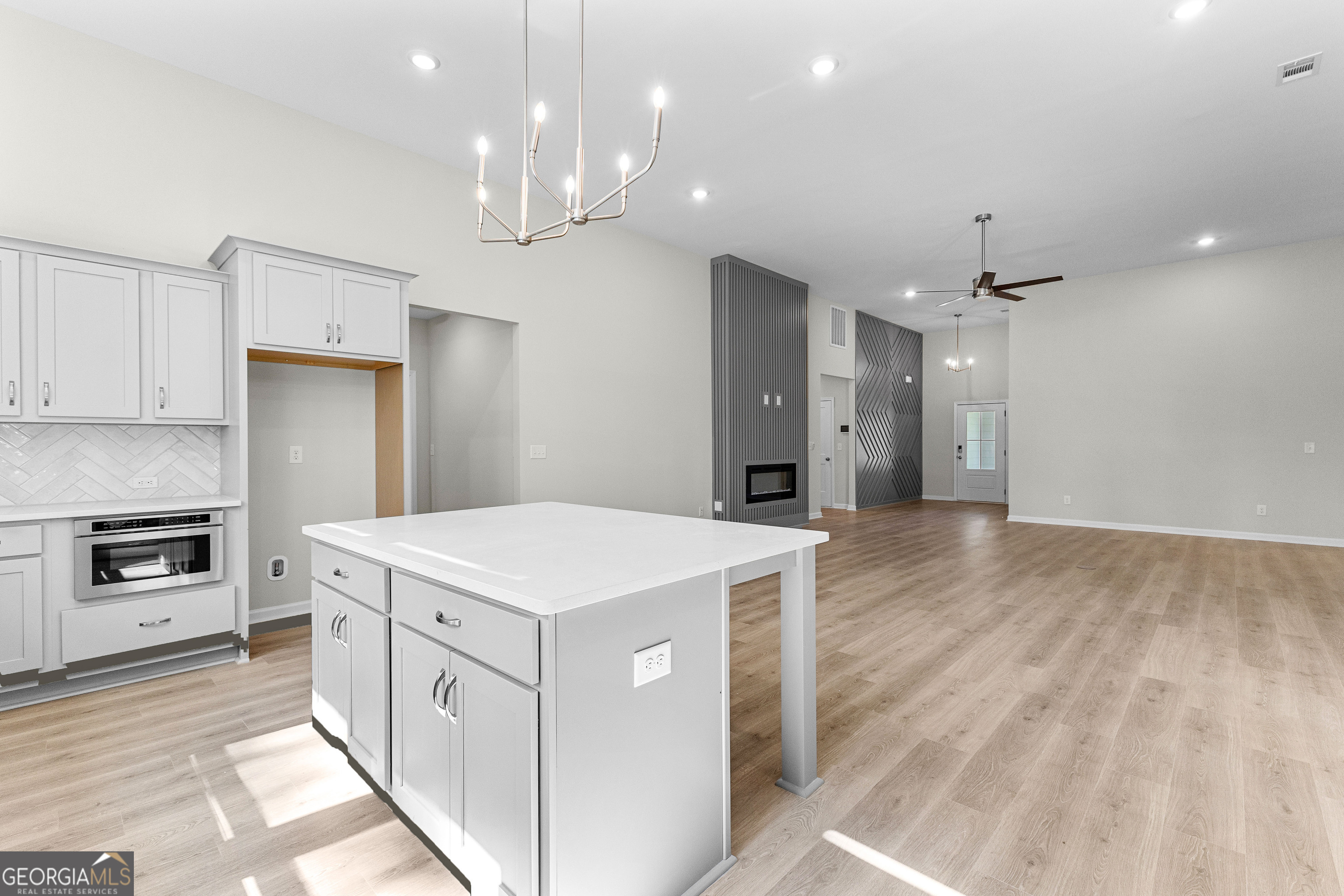 1242 Waymanville Road Thomaston, GA 30286 - Photo 20 of 52 a kitchen that has a lot of cabinets and wooden floor