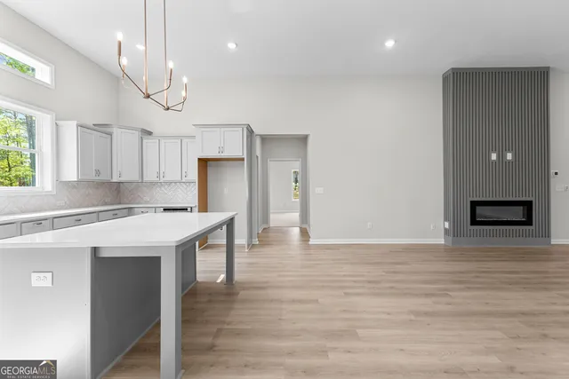 a view of kitchen with cabinets and wooden floor