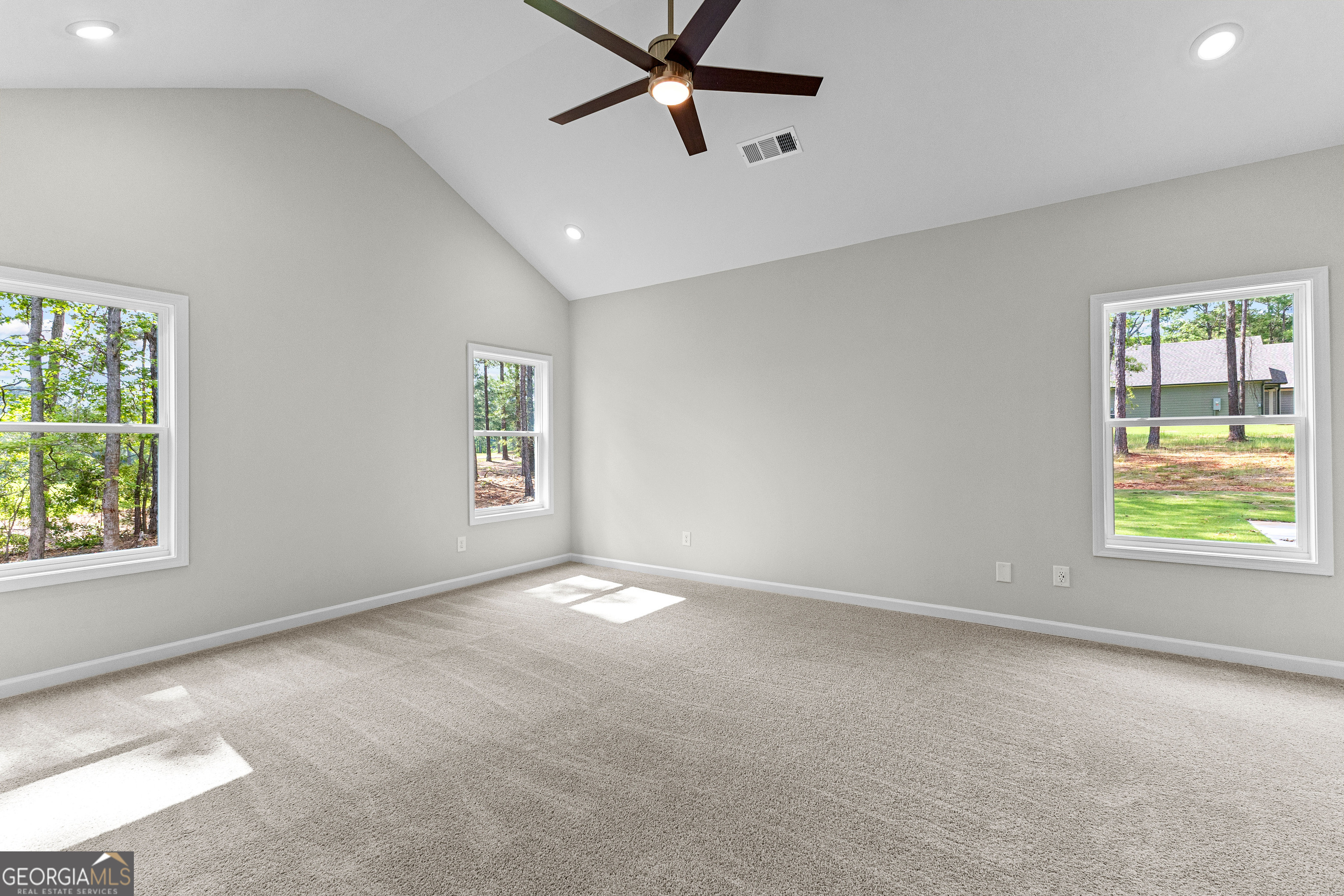 1242 Waymanville Road Thomaston, GA 30286 - Photo 23 of 52 an empty room with windows and fan