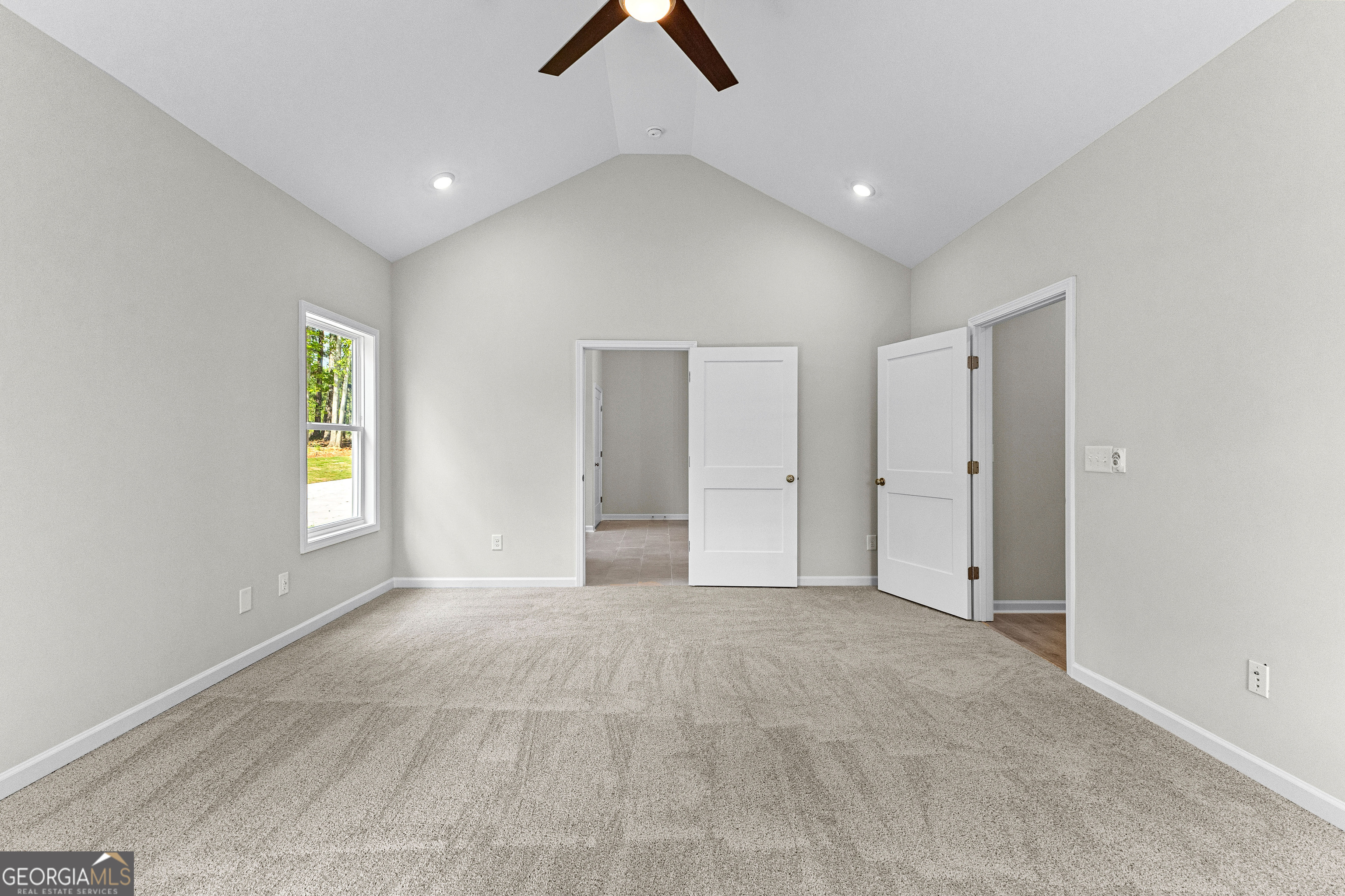 1242 Waymanville Road Thomaston, GA 30286 - Photo 25 of 52 an empty room with ceiling fan and window
