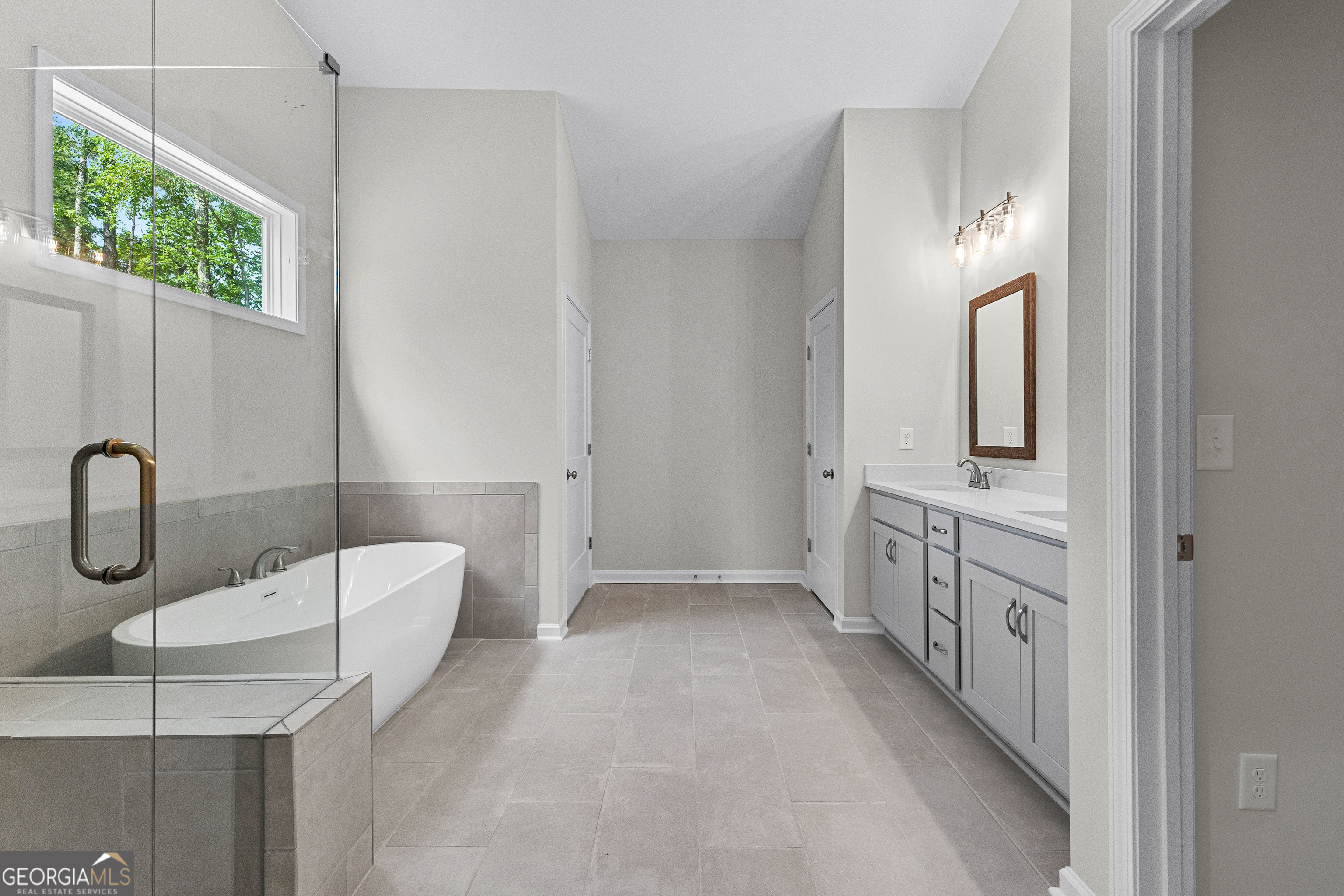 1242 Waymanville Road Thomaston, GA 30286 - Photo 26 of 52 a bathroom with a sink a toilet and mirror