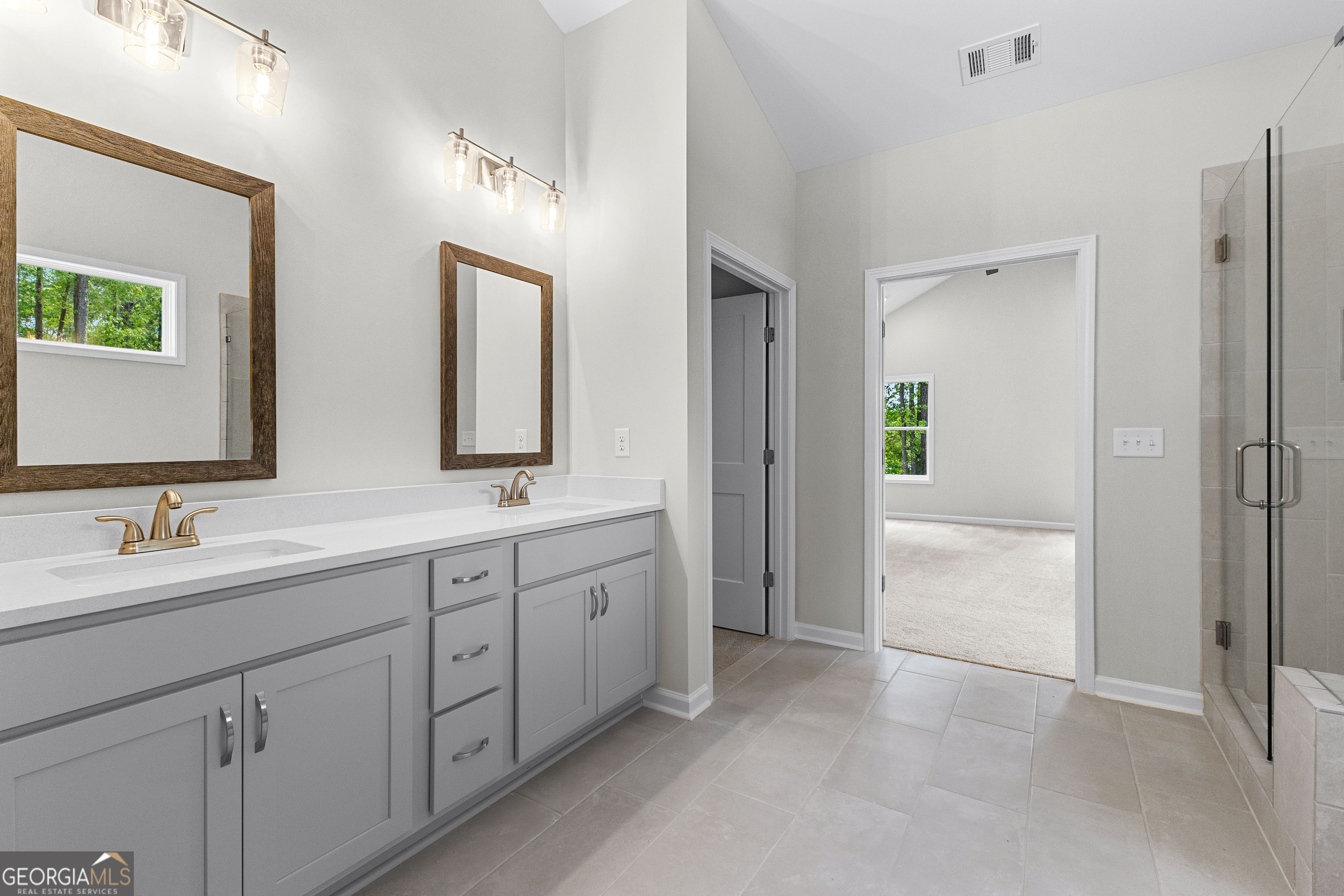 1242 Waymanville Road Thomaston, GA 30286 - Photo 28 of 52 a spacious bathroom with double sink and a mirror