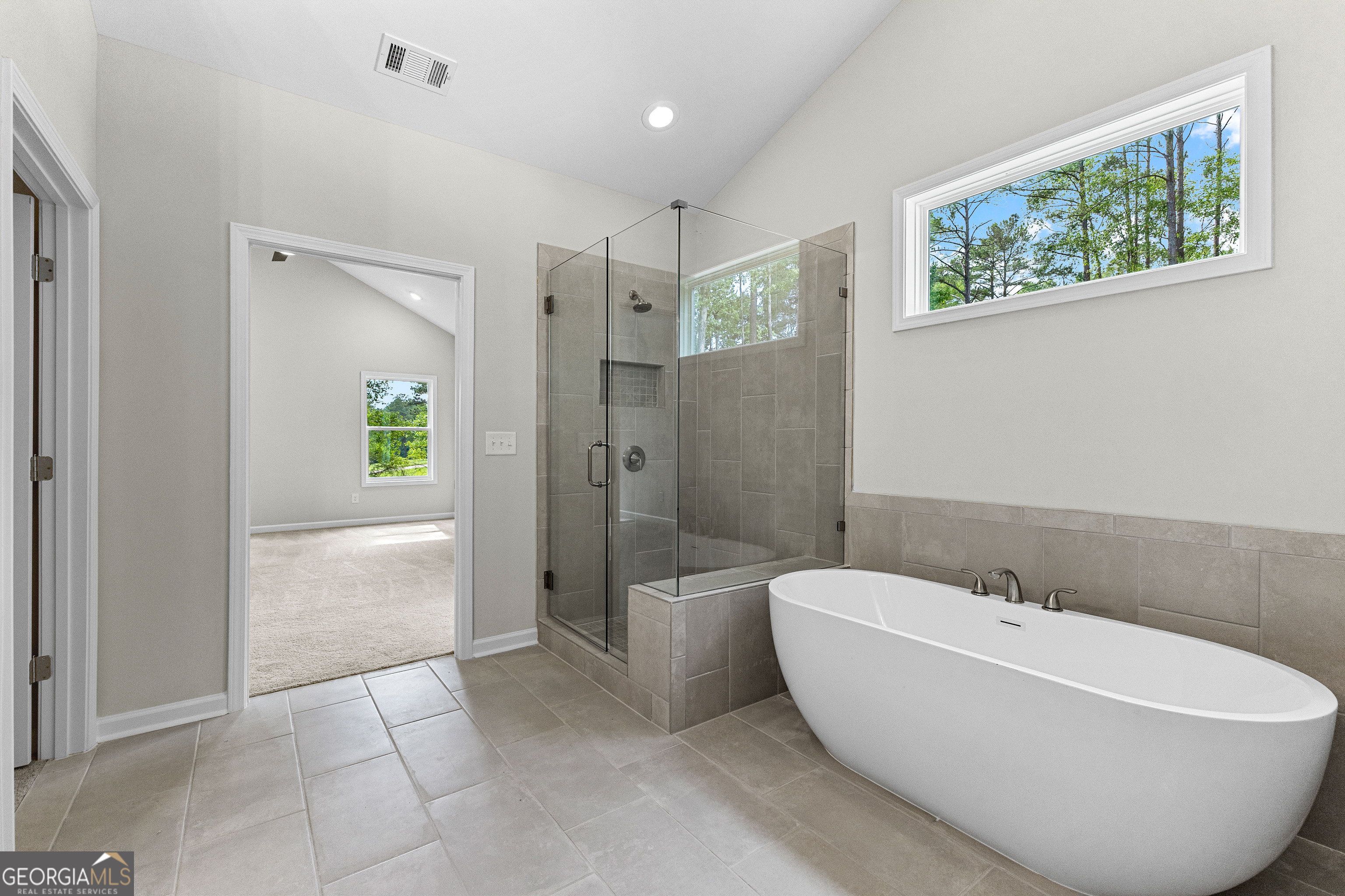 1242 Waymanville Road Thomaston, GA 30286 - Photo 29 of 52 a bathroom with a bathtub and shower