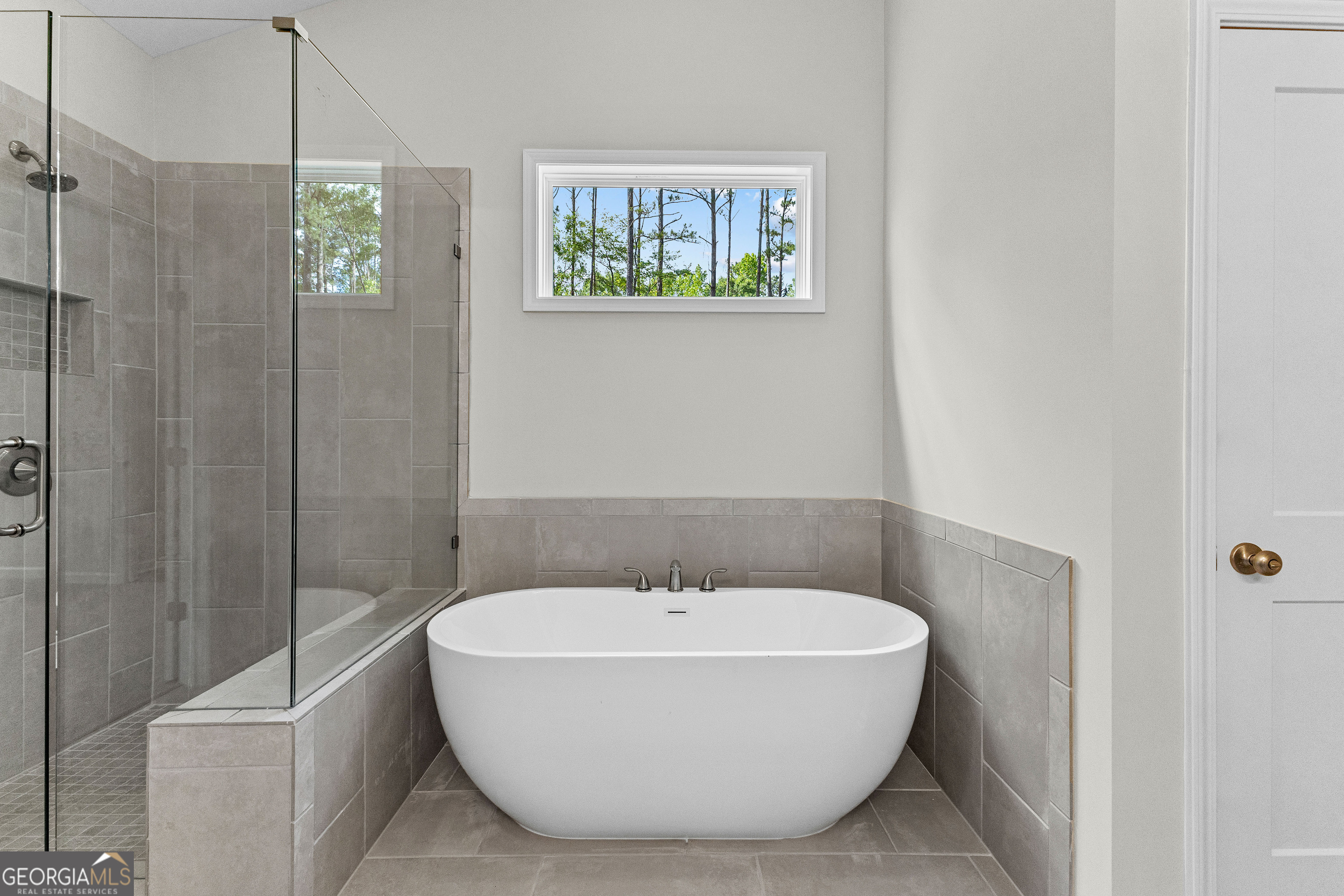 1242 Waymanville Road Thomaston, GA 30286 - Photo 30 of 52 a bathroom with a bathtub and shower