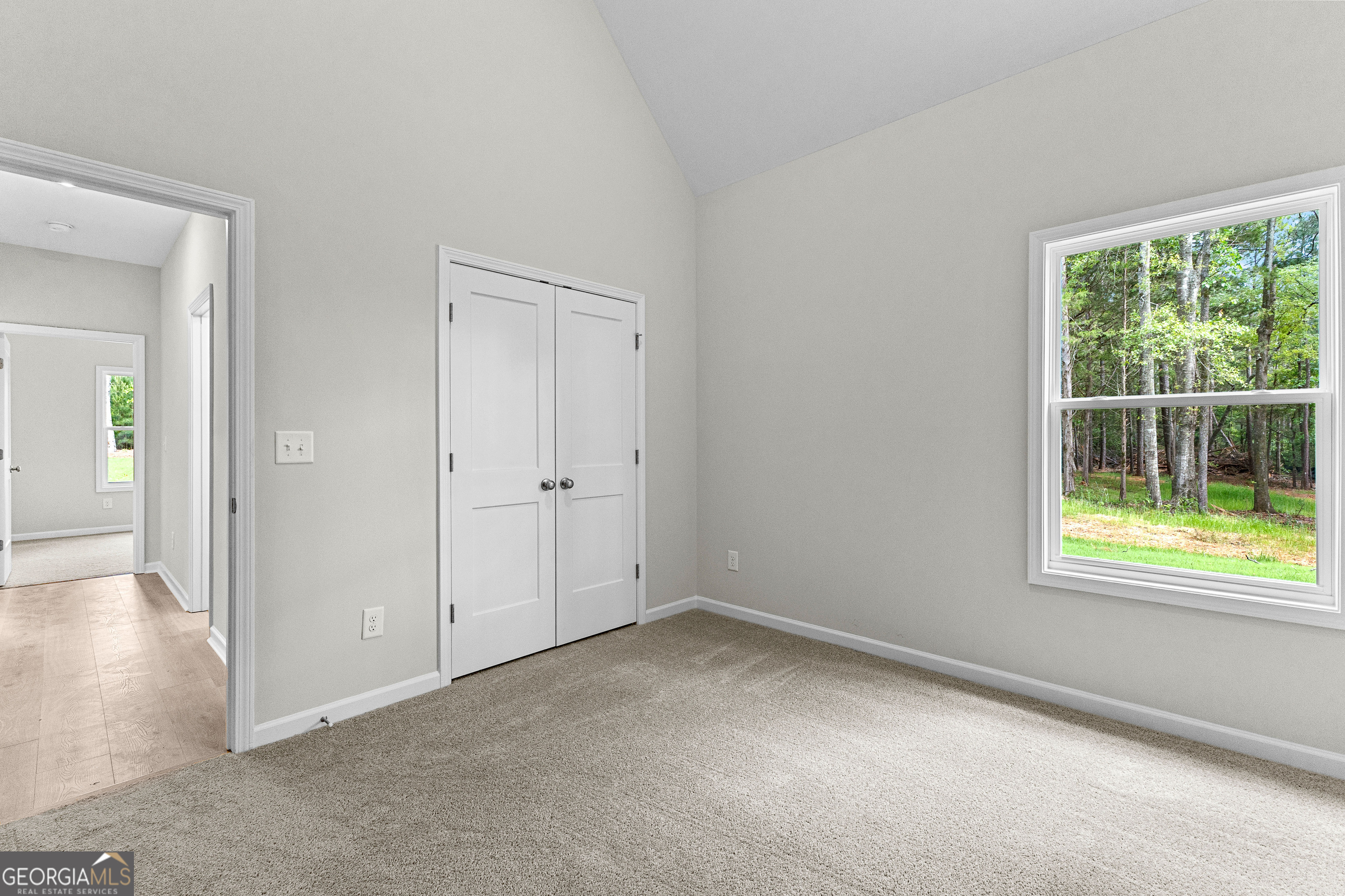 1242 Waymanville Road Thomaston, GA 30286 - Photo 37 of 52 an empty room with windows and closet