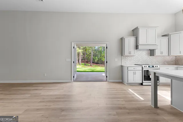 a view of room with window and pool table
