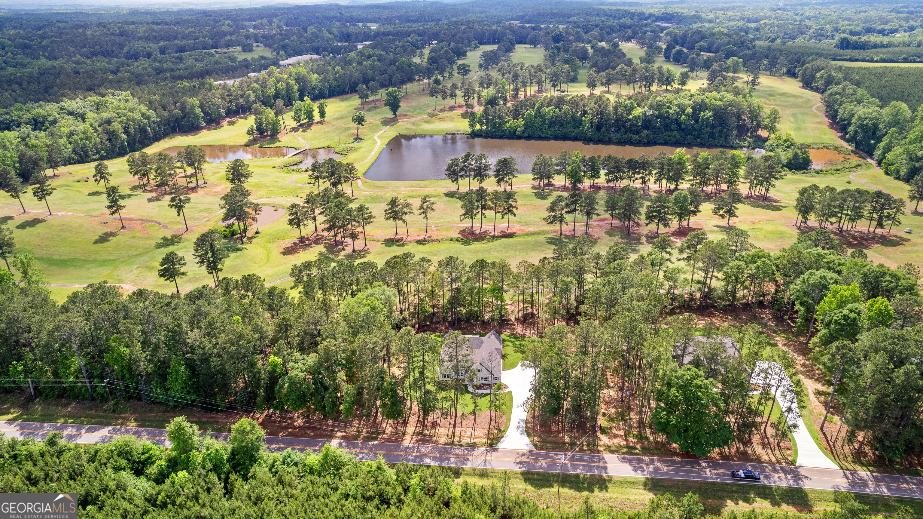 1242 Waymanville Road Thomaston, GA 30286 - Photo 52 of 52 an aerial view of residential houses with outdoor space and lake view