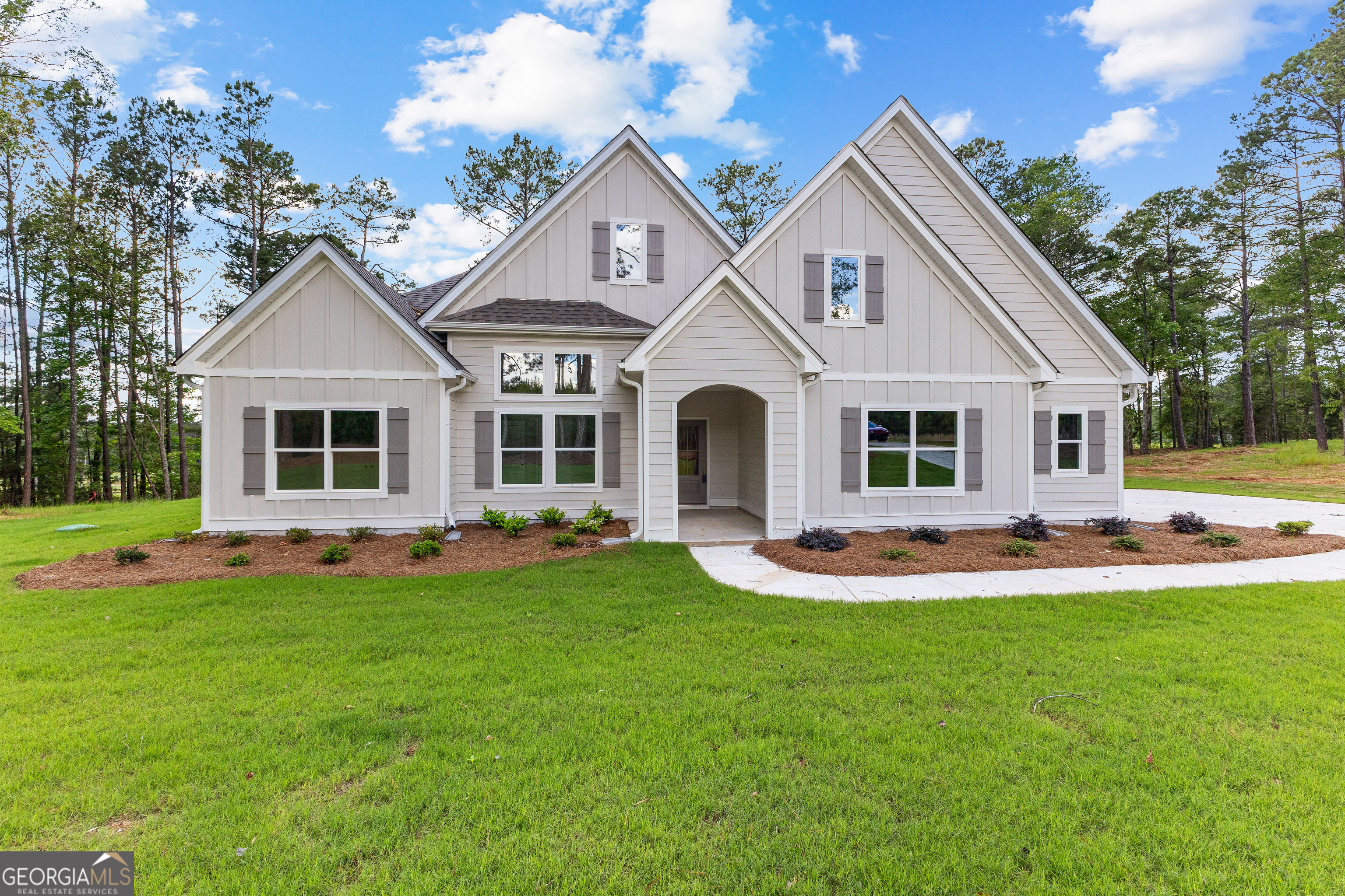 1242 Waymanville Road Thomaston, GA 30286 - Photo 7 of 52 a front view of a house with a yard and porch