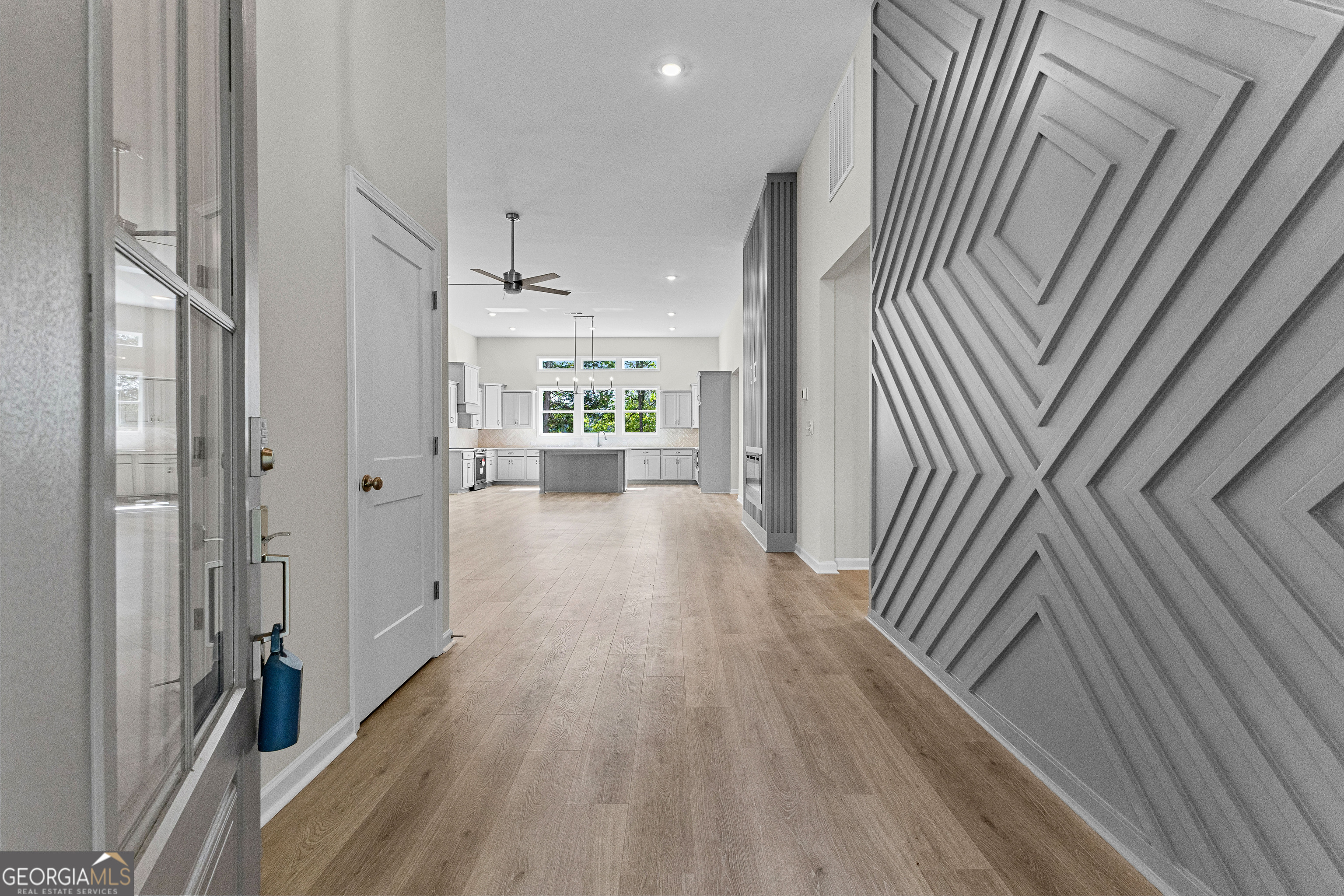 1242 Waymanville Road Thomaston, GA 30286 - Photo 10 of 52 a view of a hallway with wooden floor and staircase