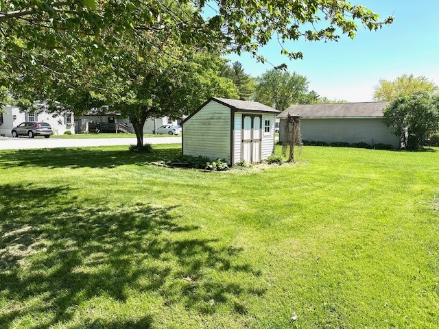 291 Highway 2 Dixon, IL 61021 - Photo 2 of 13 a view of a tree in front of a house with a small yard