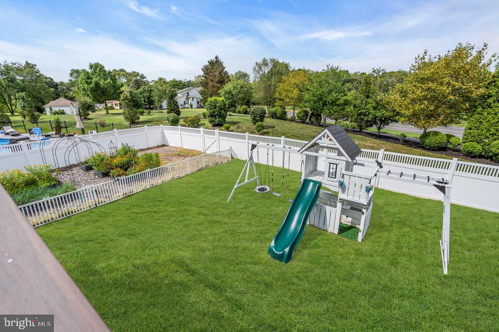 41 Buckeye Road Swedesboro, NJ 08085 - Photo 72 of 81 Spacious backyard with playset and greenery.