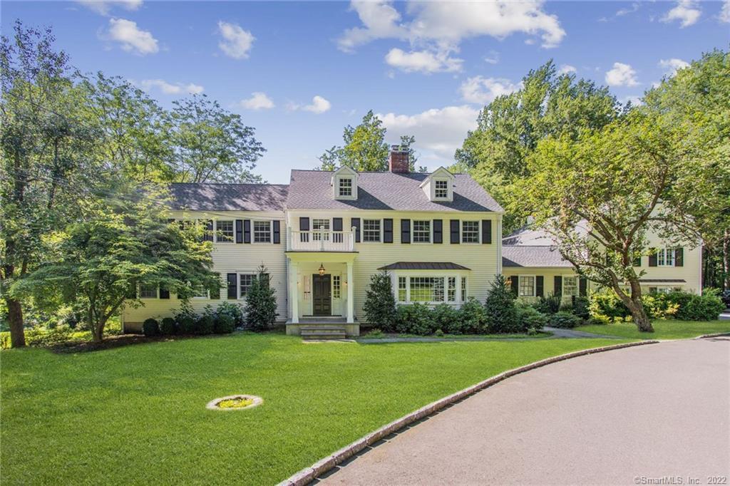 490 West Road New Canaan, CT 06840 - Photo 1 of 1 a front view of a house with a yard table and chairs
