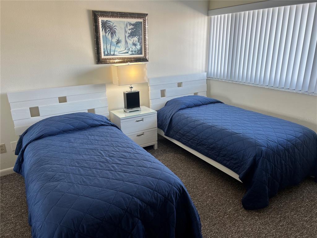 1001 Point Of Rocks Road, Unit 408 Sarasota, FL 34242 - Photo 3 of 34 a bedroom with bed and window