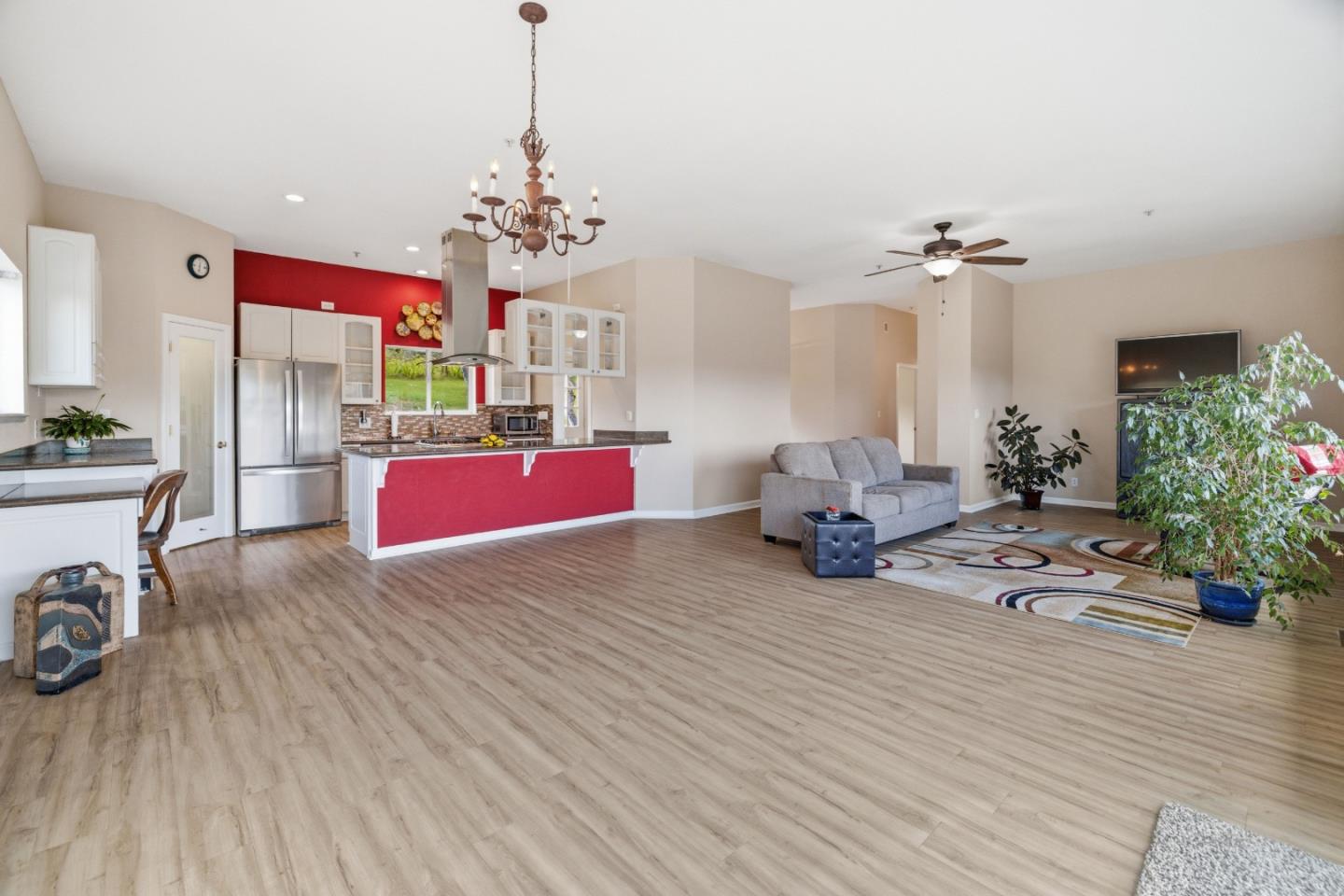 19269 Mallory Canyon Road, Unit D Salinas, CA 93907 - Photo 10 of 77 a living room with furniture and a chandelier