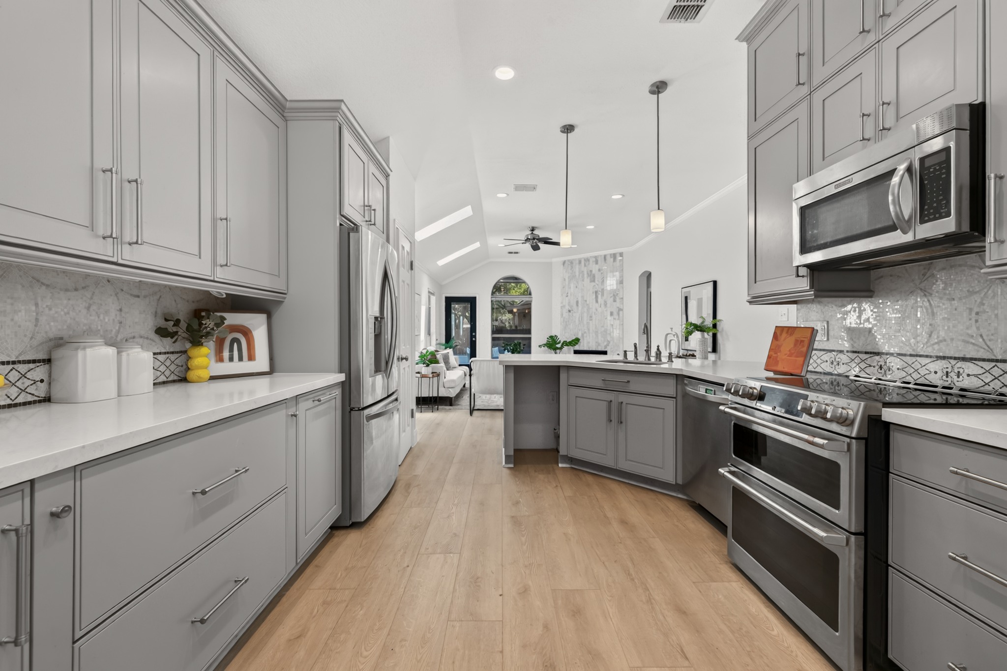 13536 Anarosa Loop Austin, TX 78727 - Photo 13 of 31 Upgraded cabinetry offers deep shelving and built-in organizers, keeping cookware neatly tucked away and out of sight