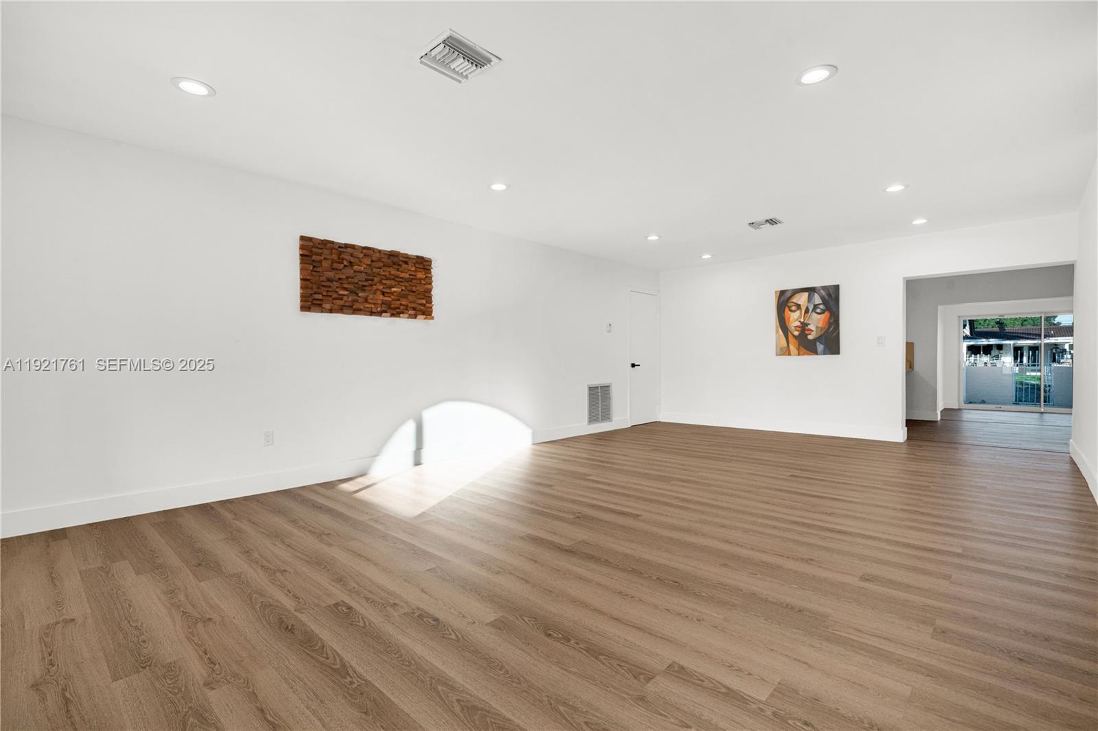 4701 Southwest 104th Court Miami, FL 33165 - Photo 1 of 16 a view of empty room with wooden floor