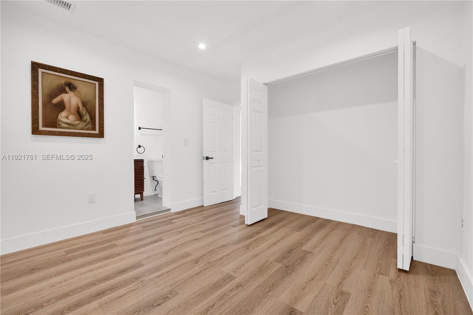 4701 Southwest 104th Court Miami, FL 33165 - Photo 11 of 16 a view of an empty room with wooden floor
