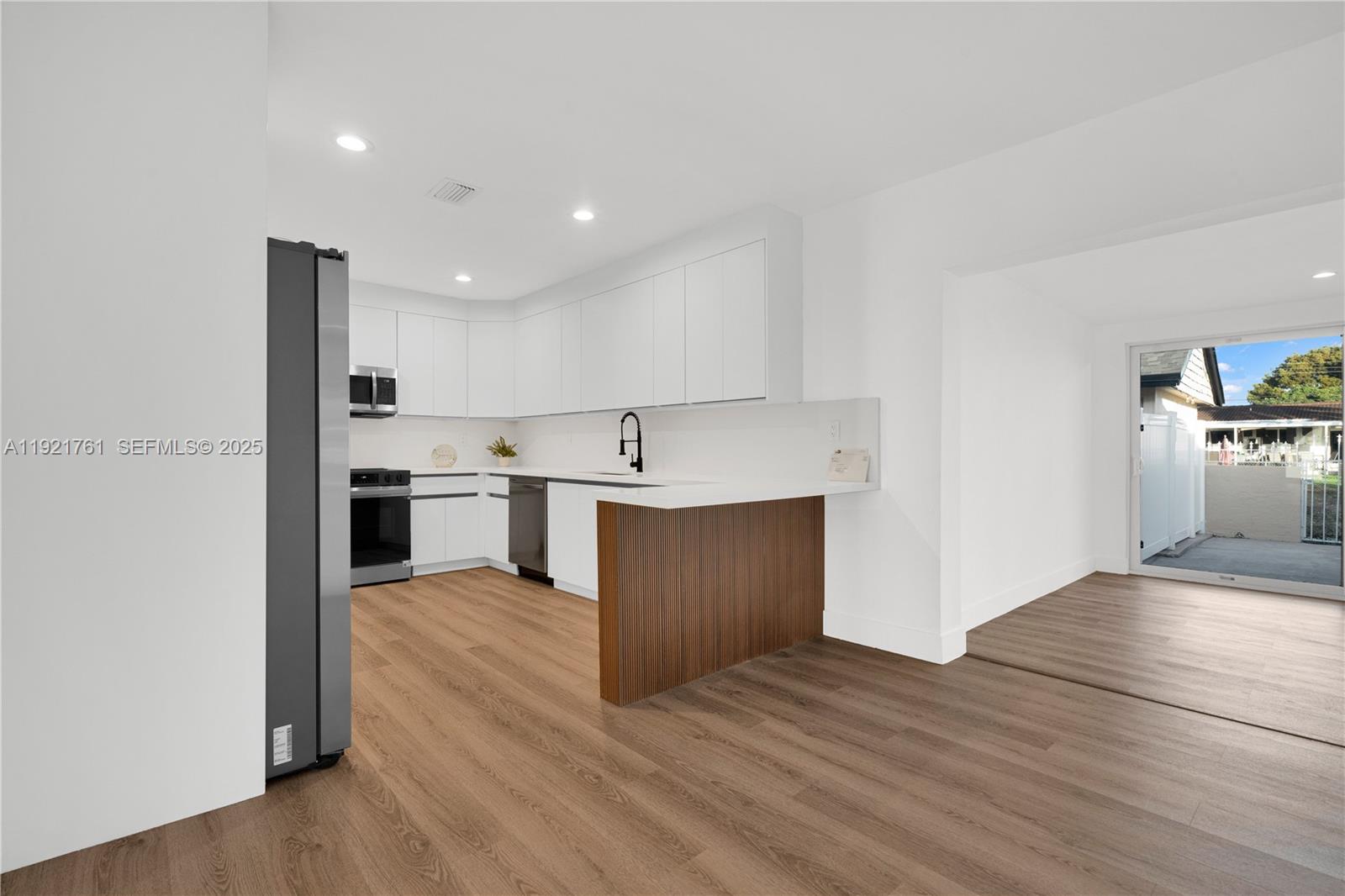 4701 Southwest 104th Court Miami, FL 33165 - Photo 4 of 16 a view of kitchen with wooden floor