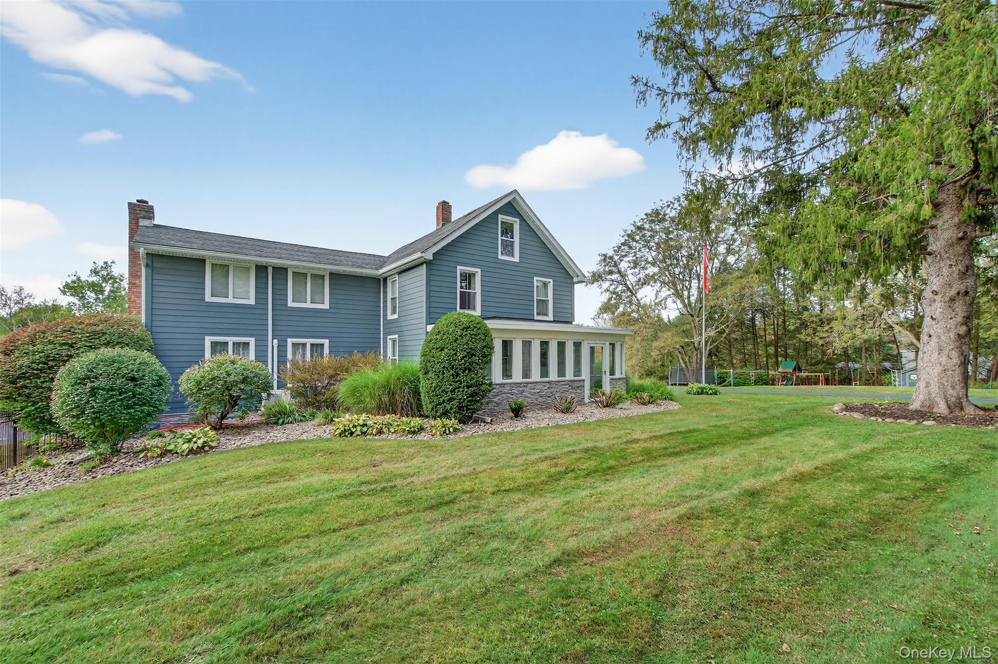 23 Creek Road Staatsburg, NY 12580 - Photo 1 of 39 a view of house in front of a big yard with large trees