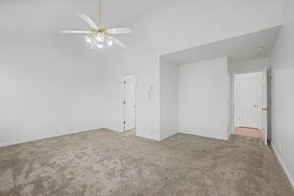a kitchen with stainless steel appliances granite countertop a kitchen island a stove a table and chairs