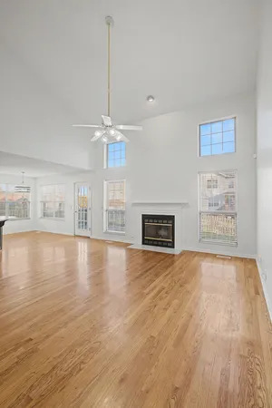 a view of an empty room with a ceiling fan