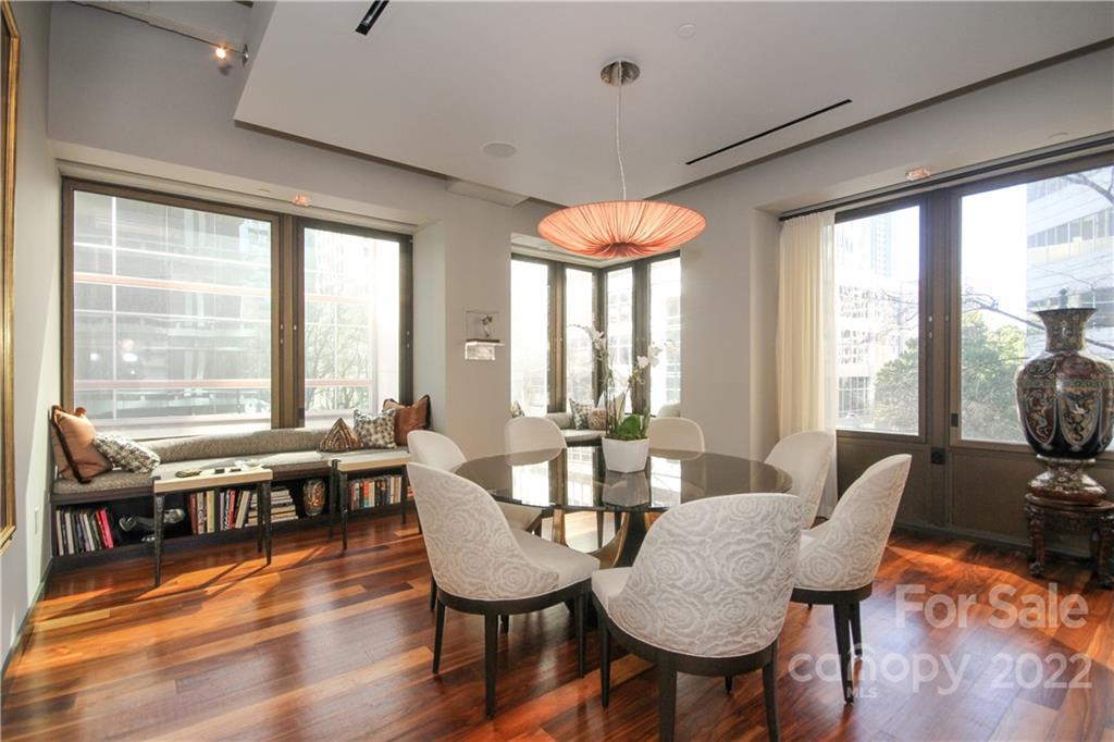 139 South Tryon Street Charlotte, NC 28202 - Photo 11 of 48 a view of a dining room with furniture window and wooden floor