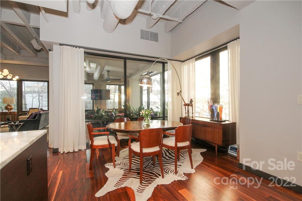 139 South Tryon Street Charlotte, NC 28202 - Photo 22 of 48 a room with lots of furniture and windows