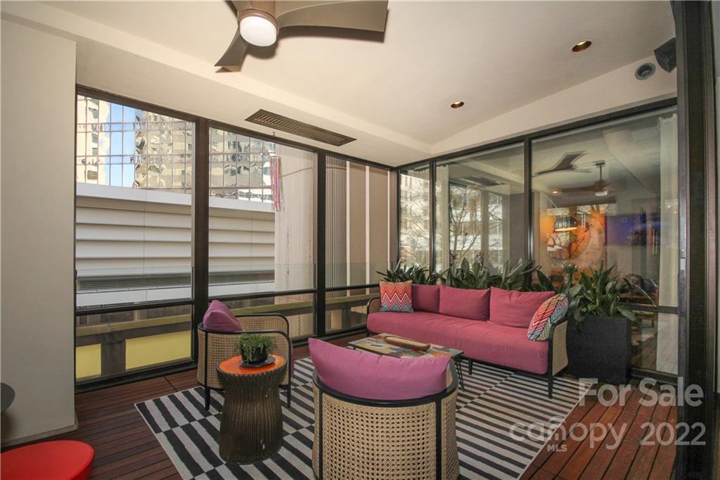 139 South Tryon Street Charlotte, NC 28202 - Photo 27 of 48 a living room with furniture and a floor to ceiling window