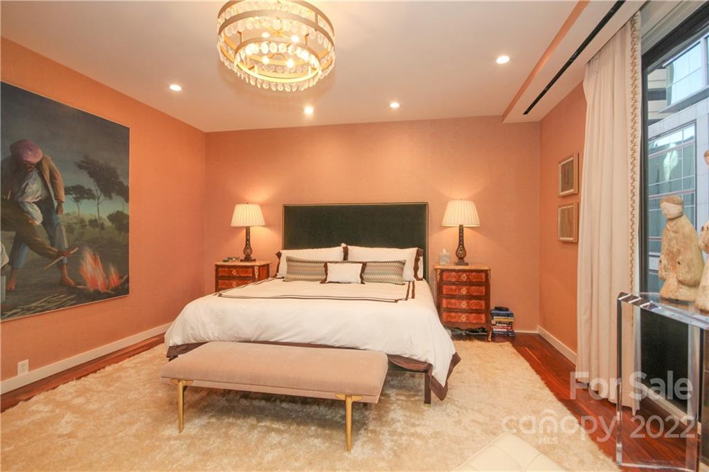 139 South Tryon Street Charlotte, NC 28202 - Photo 29 of 48 a bedroom with a bed and a flat screen tv