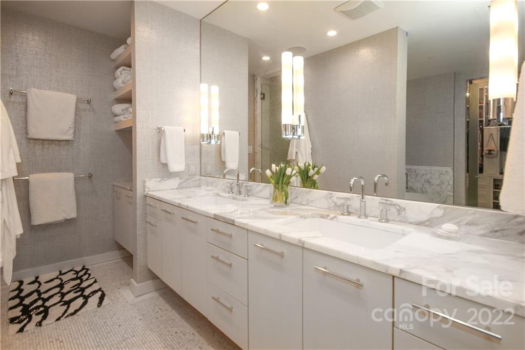 139 South Tryon Street Charlotte, NC 28202 - Photo 33 of 48 a bathroom with a double vanity sink and a mirror