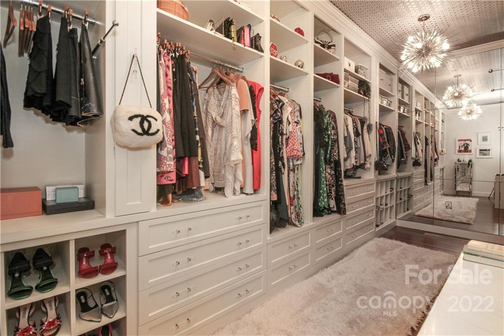 139 South Tryon Street Charlotte, NC 28202 - Photo 34 of 48 a view of walk in closet with clothes and shoes