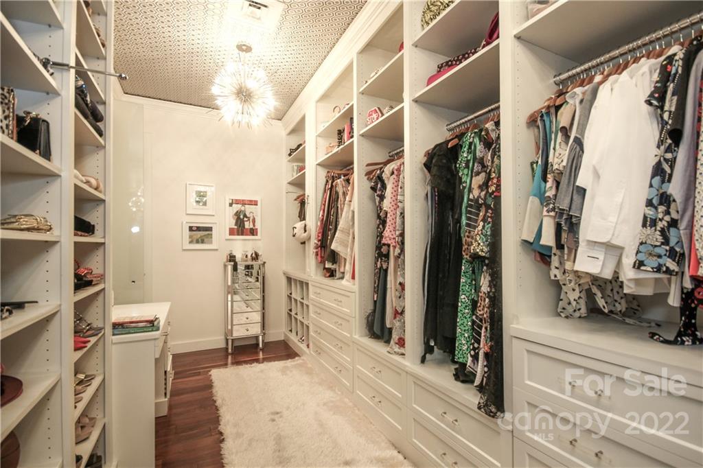 139 South Tryon Street Charlotte, NC 28202 - Photo 35 of 48 a view of walk in closet with clothes and shoes